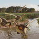 Artist’s conception of Dineobellator notohesperus, along with some contemporaries, including the long-necked Alamosaurus and three-horned Ojoceratops.